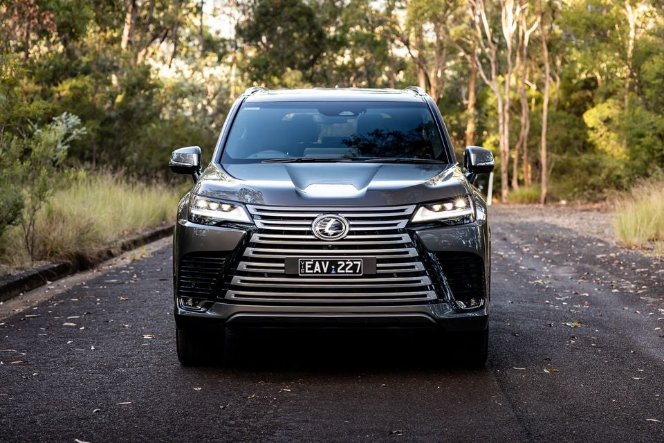 A dark grey 2026 Lexus LX700h Sports Luxury large SUV seen from the front on a bush road in Australia