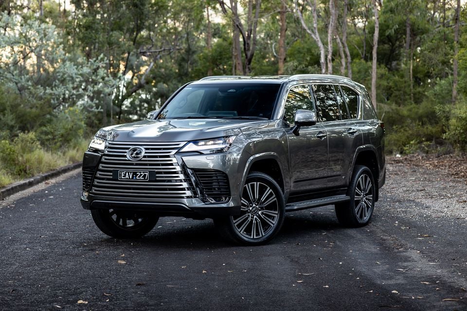 A silver 2026 Lexus LX700h Sports Luxury large SUV seen from the front-side angle on a bush road in Australia