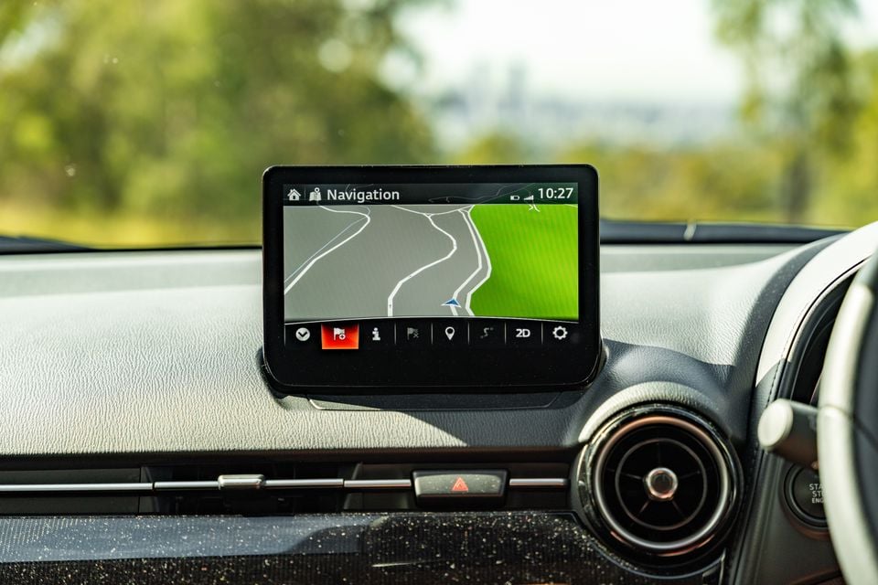 The navigation screen on the infotainment display of a Mazda CX-3, showing a map view on the dashboard