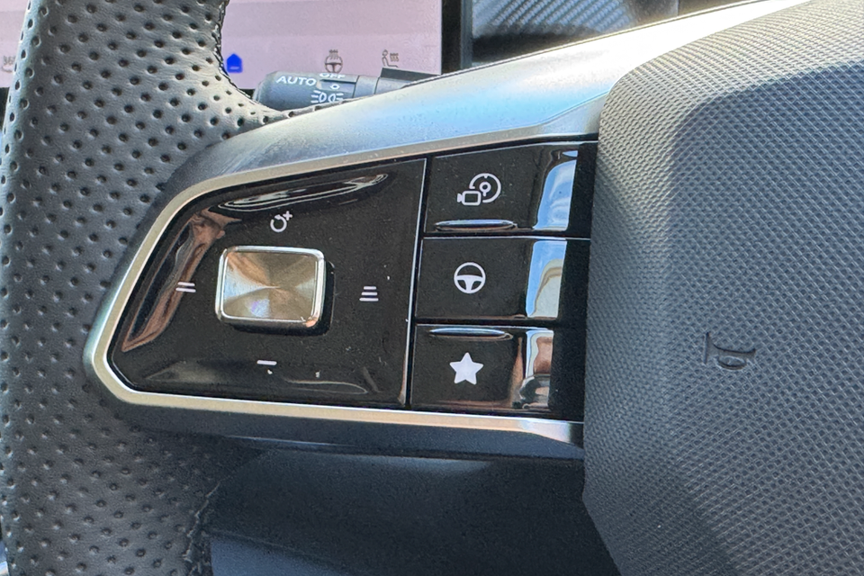 Close-up of the right-side steering wheel controls on a 2026 MG4 EV, showing buttons for driver assistance, lane keeping, and a favourites shortcut