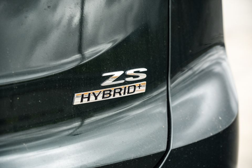 Close-up of the ZS Hybrid+ badge on the rear of a dark-coloured MG ZS Hybrid+ SUV