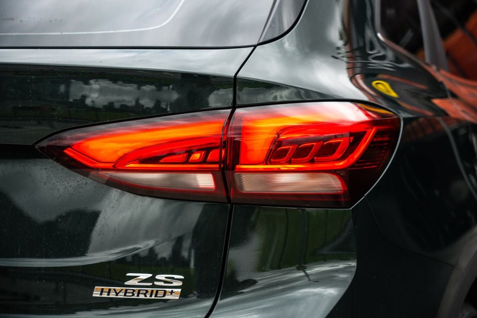 Close-up of the rear tail light and ZS Hybrid+ badge on a dark grey MG ZS Hybrid+ SUV