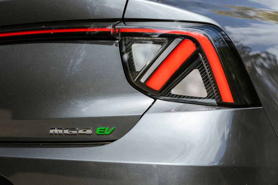Close-up of the rear tail light and MG4 EV badge on a grey MG4 EV