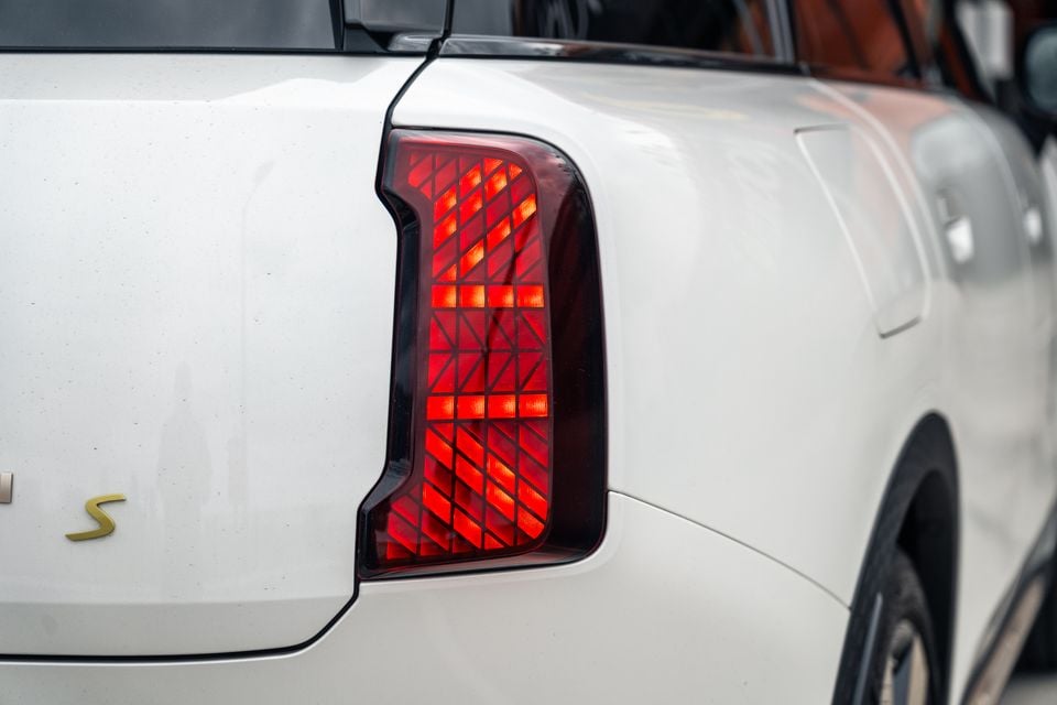 Close-up of the rear tail light on a white 2026 Mini Countryman S, showing a geometric grid pattern design.