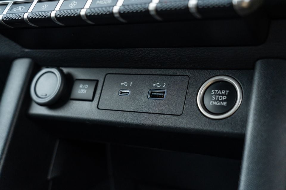 Centre console of a 2026 Mitsubishi Triton GSR with USB-C and USB-A ports, a start/stop engine button and a rear diff lock switch