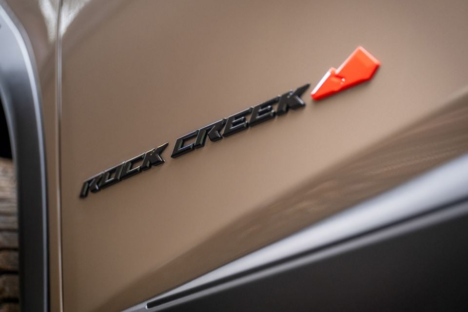 Close-up of the Rock Creek badge on the exterior panel of a 2026 Nissan Rogue Rock Creek