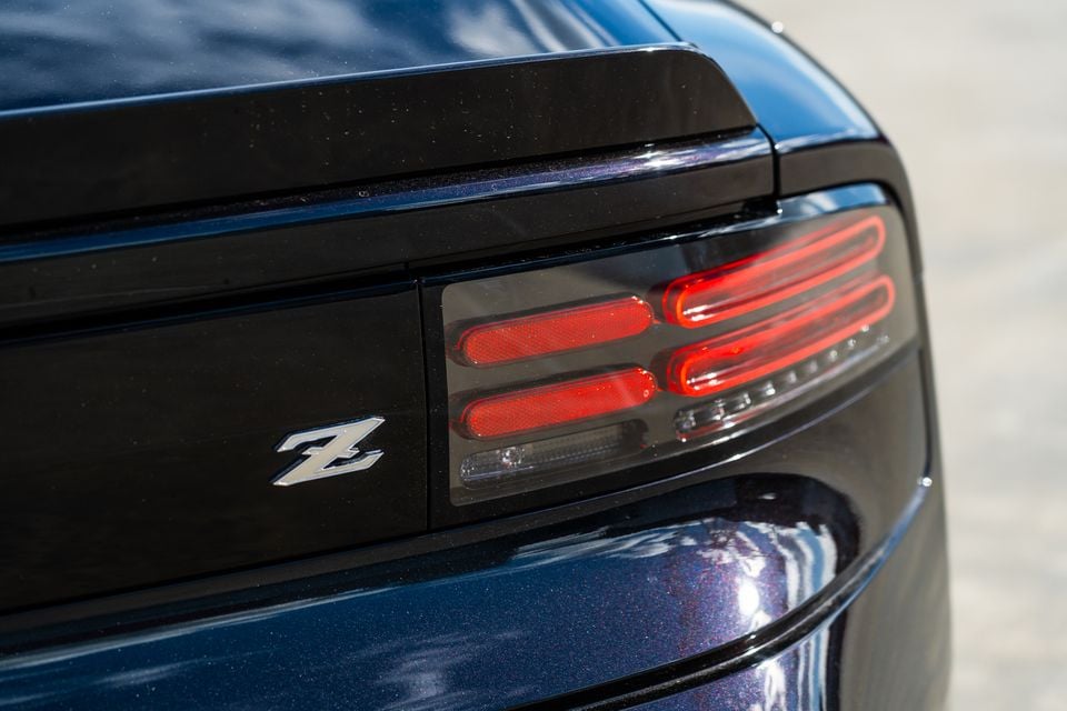 Close-up of the rear tail light and Z badge on a blue 2026 Nissan Z Heritage edition