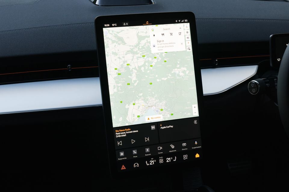 The large portrait-orientation touchscreen infotainment display in a Polestar 3, showing a Google Maps navigation view of Melbourne and media controls for Sky News Radio via DAB+