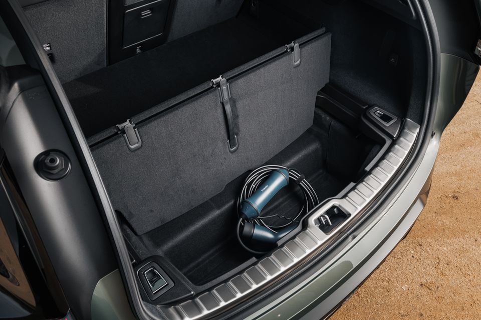 The boot of a 2026 Polestar 3 SUV open, showing the cargo area with a Polestar charging cable stored inside