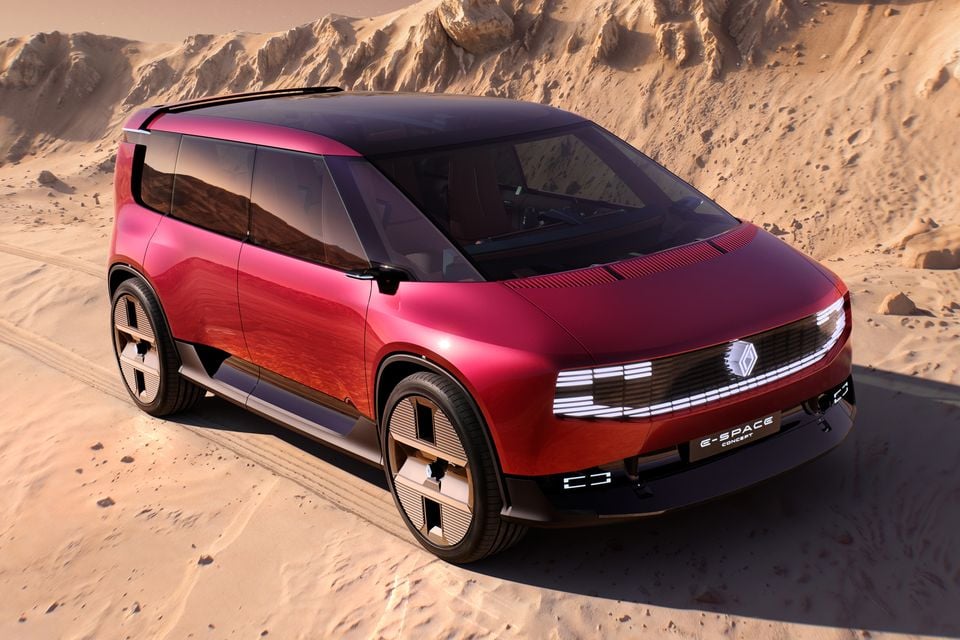 A red Renault E-Space Concept people mover parked on desert sand, seen from the front and side from a raised angle