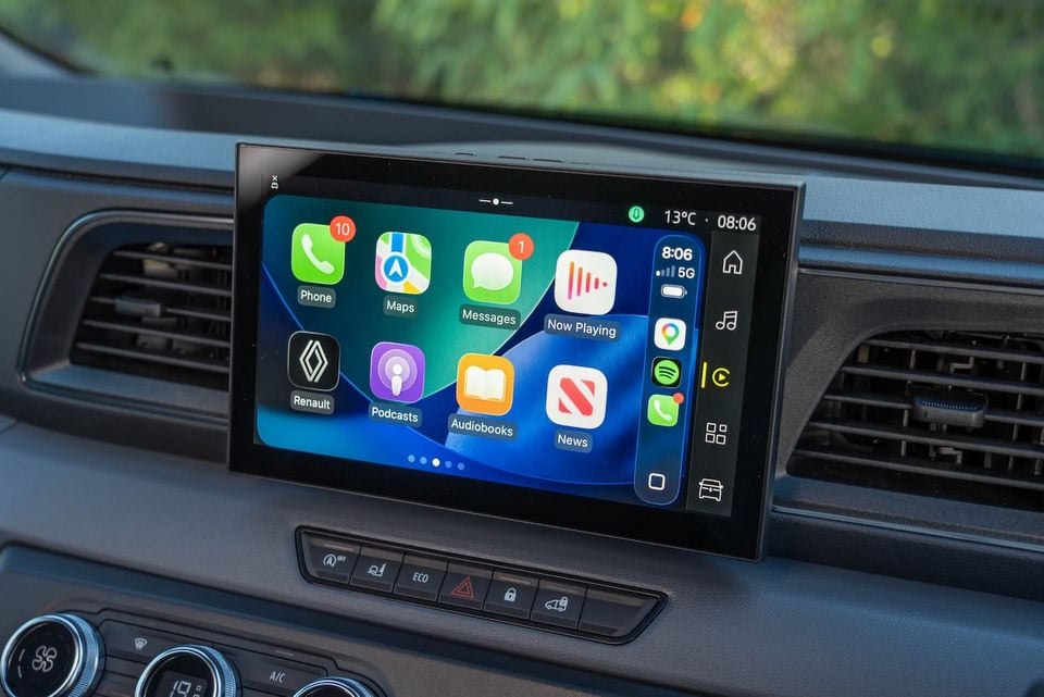 Apple CarPlay interface displayed on the touchscreen infotainment system of a Renault Master, showing apps including Phone, Maps, Messages, Podcasts, Audiobooks and News