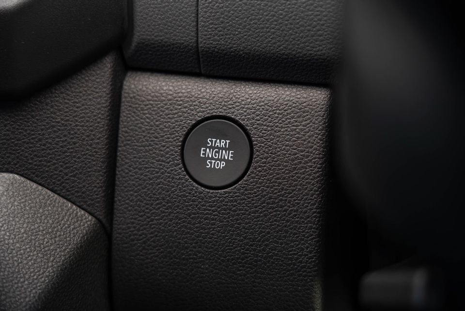 Close-up of the Start Engine Stop button on the dashboard of a Renault Master