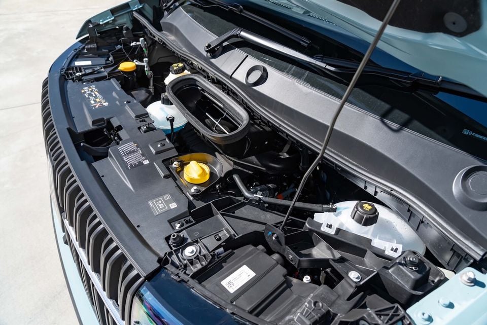 Engine bay of a 2026 Renault Master diesel van with the bonnet open, showing the engine components and fluid reservoirs