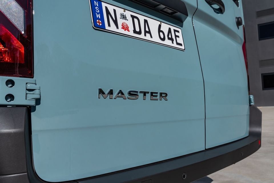Close-up of the rear of a Renault Master van showing the 'Master' badge and NSW licence plate