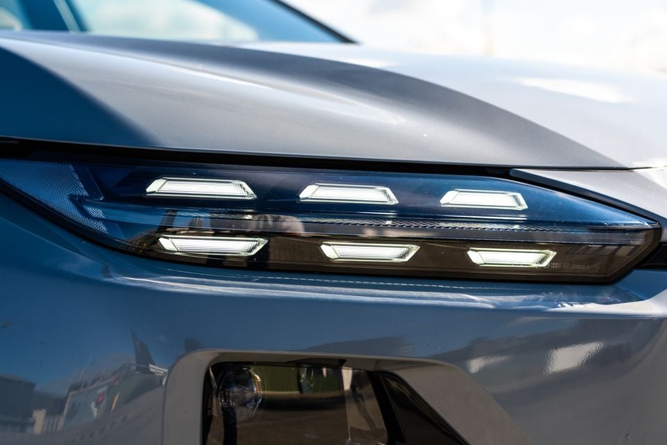 Close-up of the LED headlight cluster on a grey 2026 Subaru Outback, showing dual rows of rectangular LED daytime running lights