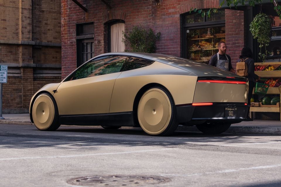 Gold Tesla Cybercab viewed from the rear three-quarter angle in an existing publicity image; not evidence of Australian service availability.