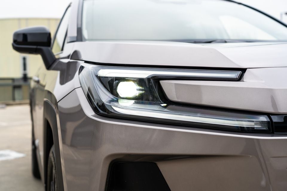 Close-up of the headlight on a silver 2026 Toyota RAV4 Cruiser SUV