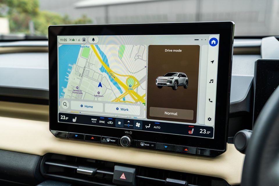 The infotainment touchscreen of a 2026 Toyota RAV4 Cruiser shows a navigation map and drive mode selection screen.
