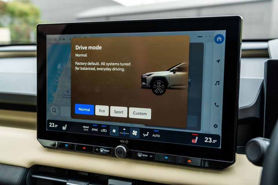 The infotainment touchscreen in a 2026 Toyota RAV4 displaying the drive mode selection menu with Normal mode highlighted.