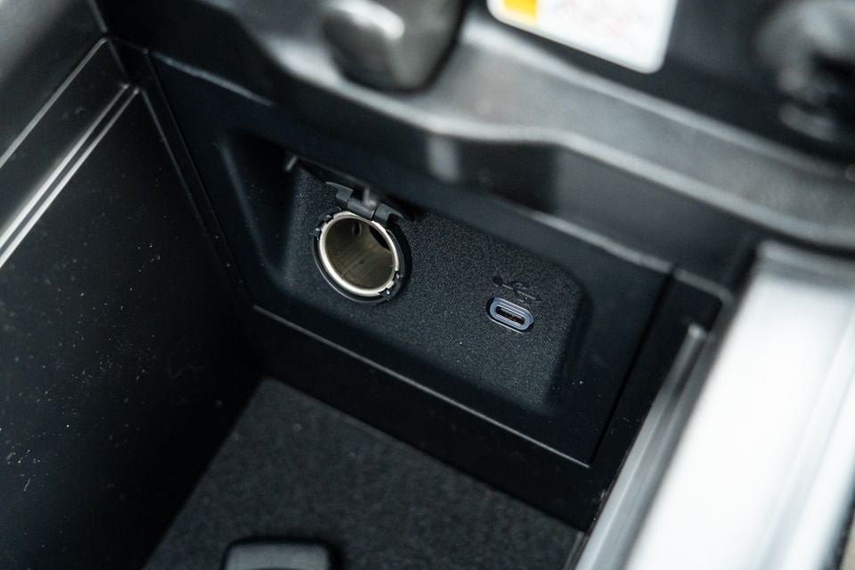 Close-up of a 2026 Toyota RAV4's centre console showing a 12-volt power outlet and USB-C port