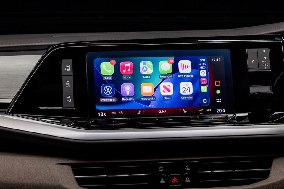 Apple CarPlay displayed on the touchscreen infotainment system of a Volkswagen Multivan, showing apps including Phone, Music, Maps, Messages and Podcasts