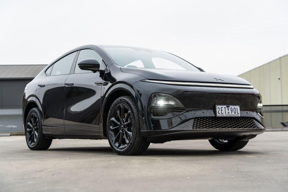 A black 2026 Xpeng G6 AWD Performance Black Edition SUV seen from the front-left side, parked on a concrete surface in Victoria, Australia