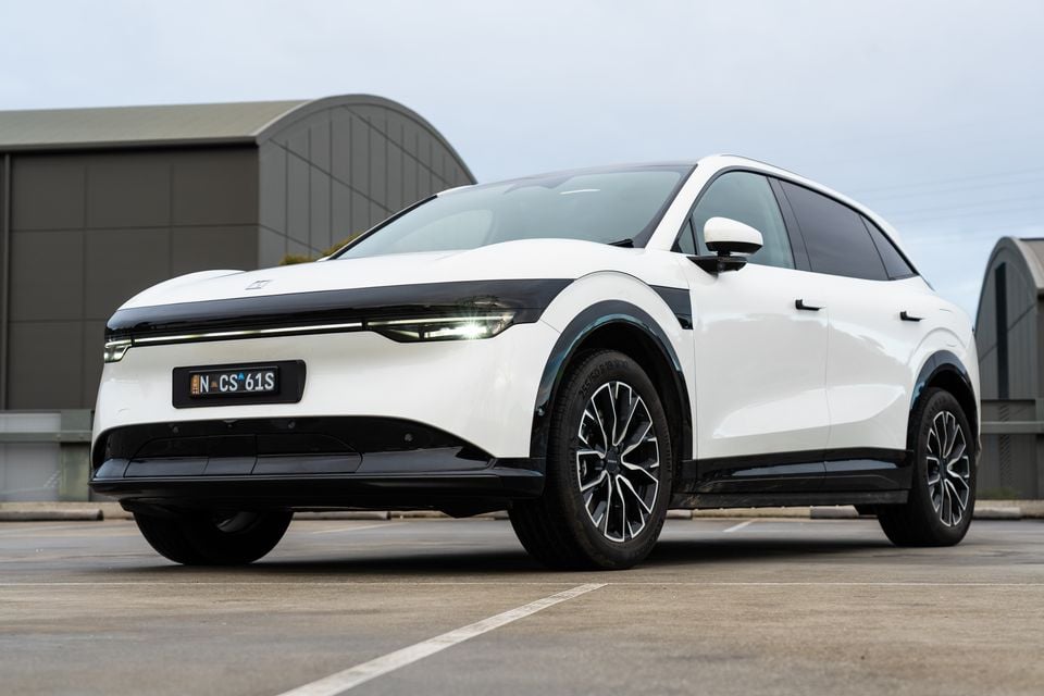 A white 2026 Zeekr 7X electric SUV parked in a lot, seen from the front quarter view