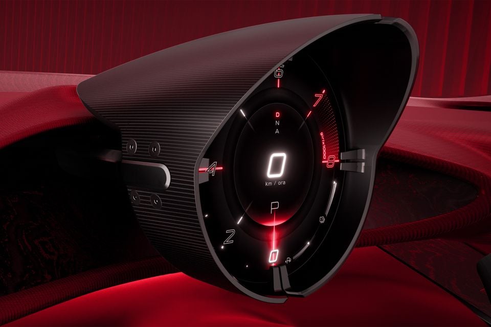 Digital instrument cluster in the 2026 Alfa Romeo Cuorerosso, with a glowing red tachometer dial and speedometer in a ribbed cowl