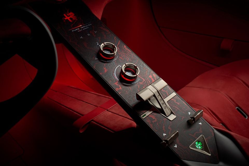 Centre console of the 2026 Alfa Romeo Cuorerosso with rotary dials, PRND gear selector and red suede seats