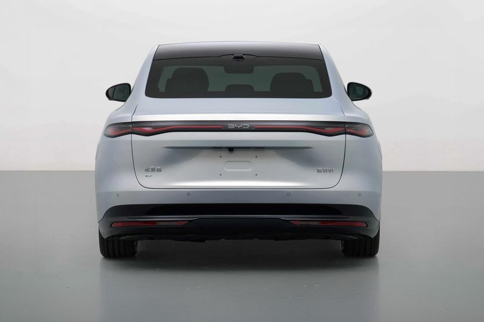 Rear view of a silver BYD Seal 07 EV sedan on a white studio background