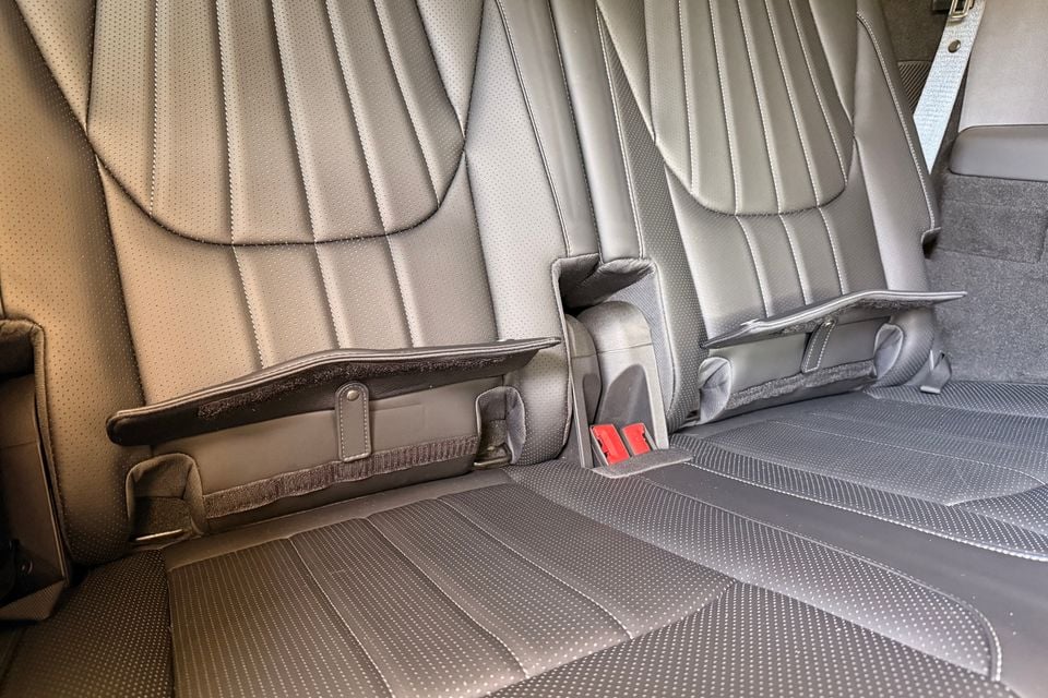Rear seat bench in a 2026 BYD Sealion 8, shown folded down with the seatback partially lowered