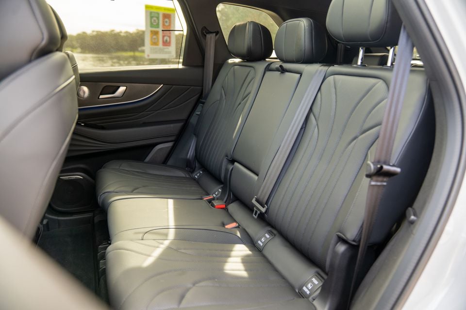 The rear seat row of a 2026 Chery Tiggo 9, showing dark leather upholstery with seatbelts and headrests