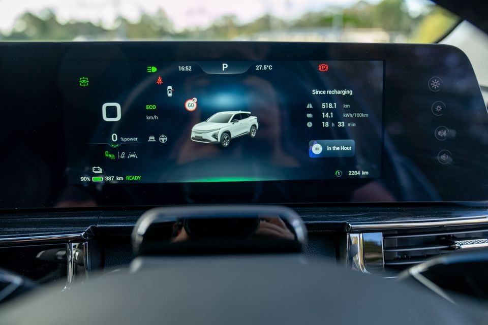 The infotainment screen of a Chery E5 electric SUV showing EV range, energy consumption stats, and ECO drive mode display