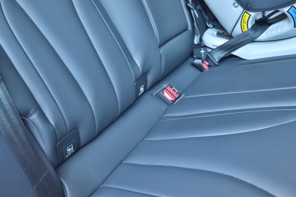 Close-up of the rear seats in a 2026 Chery Tiggo 7 showing ISOFIX child seat anchor points and seatbelt buckles