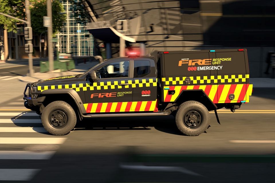 A 2026 Ford Ranger Super Duty prototype ute in a Fire Response Unit livery with black, yellow, and red chequered markings and emergency lights, seen from the side while driving through a city street