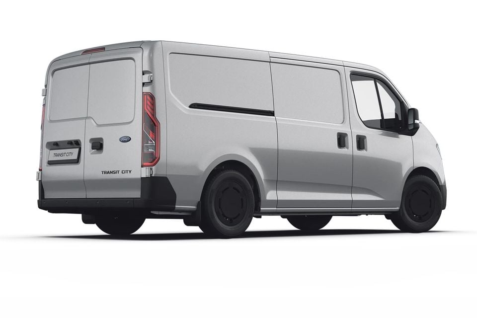 A silver Ford Transit City van seen from the rear three-quarter angle on a white background