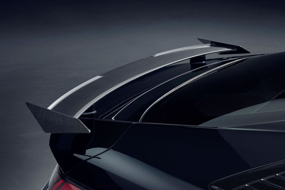 Carbon-fibre rear spoiler on the boot lid of a black 2026 Hyundai i30 Sedan N Monochrome