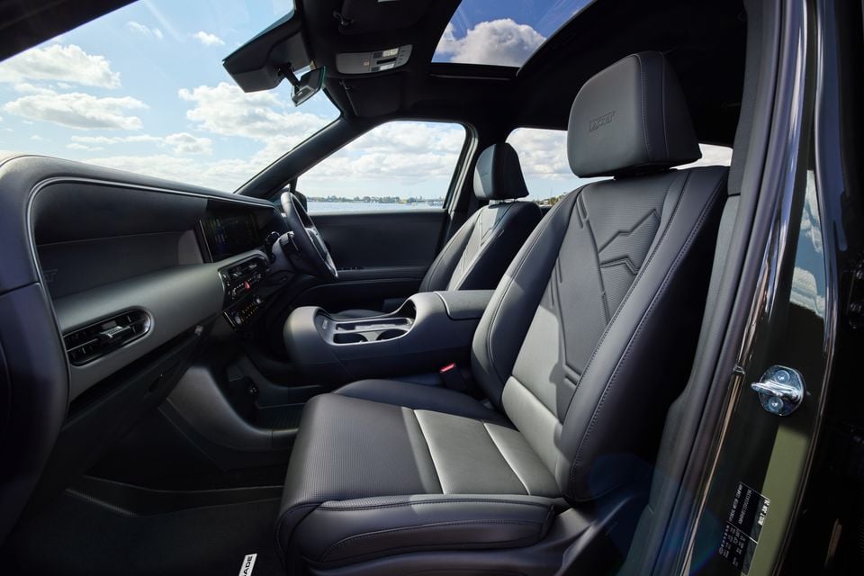 Interior view of a 2026 Hyundai Palisade XRT Pro showing the front seats, centre console, dashboard and infotainment screen, with a panoramic sunroof above