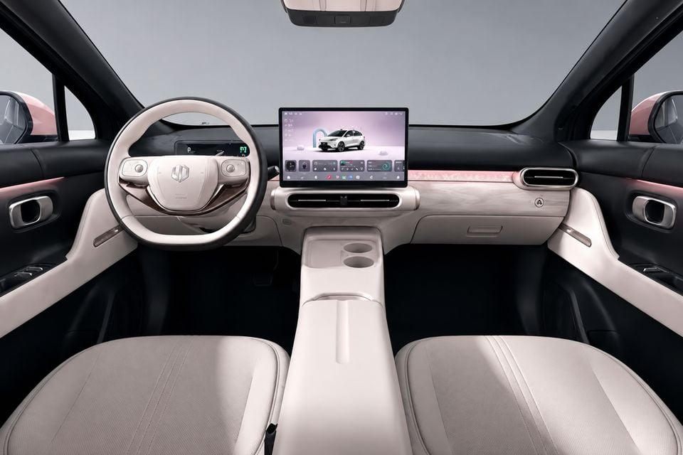 Interior of the 2026 Leapmotor B03 showing the dashboard, steering wheel, large central touchscreen infotainment display, and light-coloured front seats