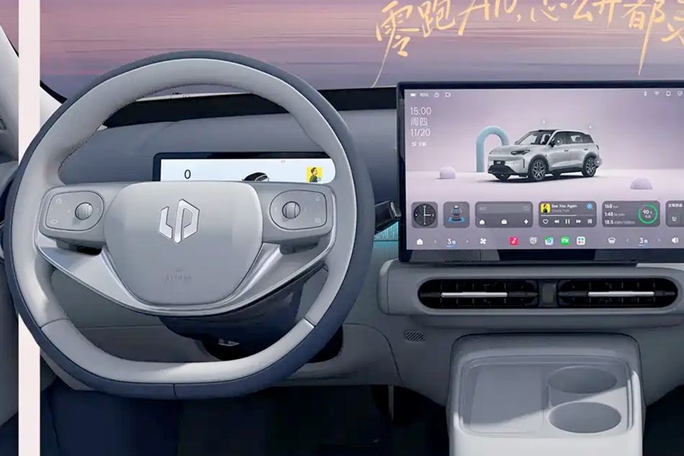 Interior of a Leapmotor B03X showing the steering wheel and large central touchscreen infotainment display with a car graphic on screen