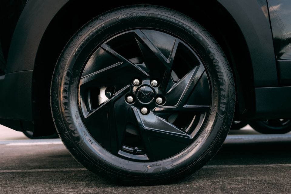 Close-up of a black multi-spoke alloy wheel with Goodyear Assurance TripleMax 2 tyre on a 2026 Mahindra XUV3XO Black Edition