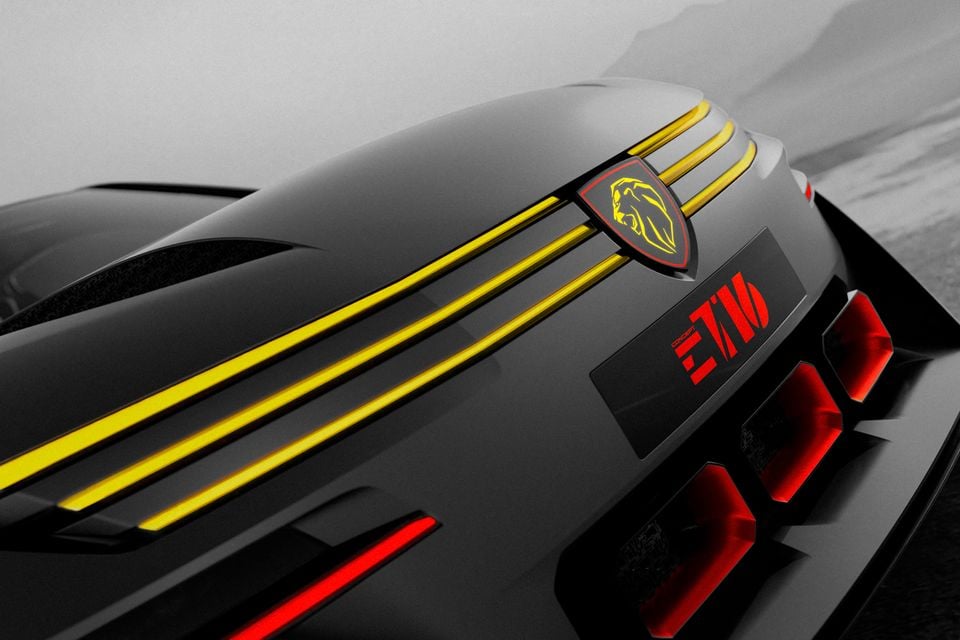Close-up of the rear of the black Peugeot E-T16 concept with its lion badge, yellow stripes and red claw-style tail-lights