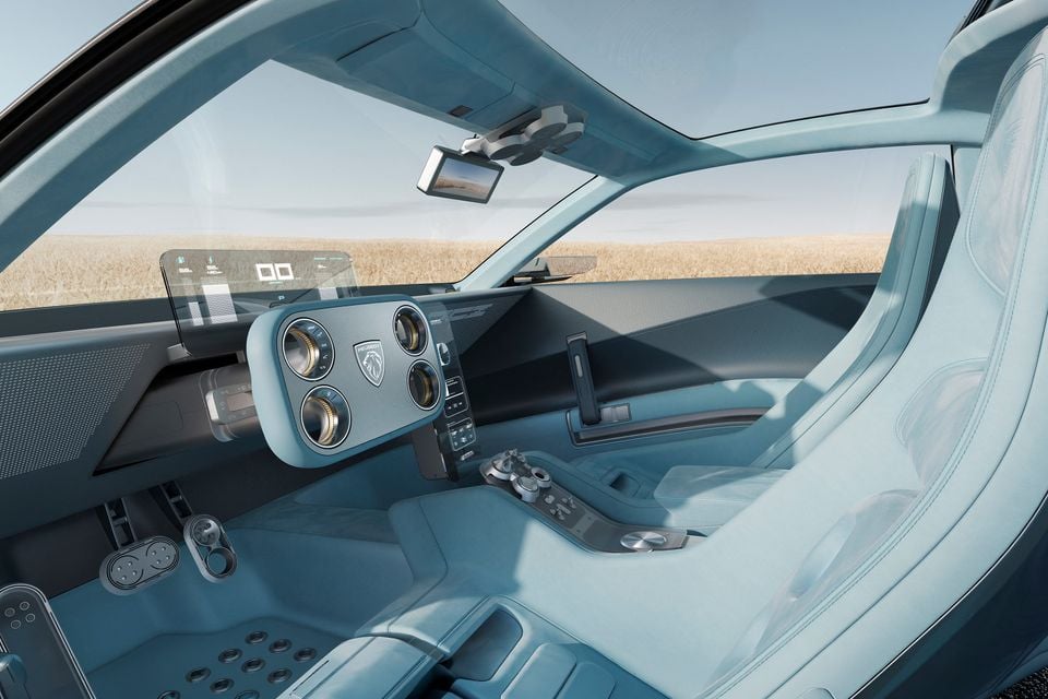 Light blue interior of the Peugeot Vision RCZ concept with a square steering yoke, floating head-up display and sculpted bucket seats