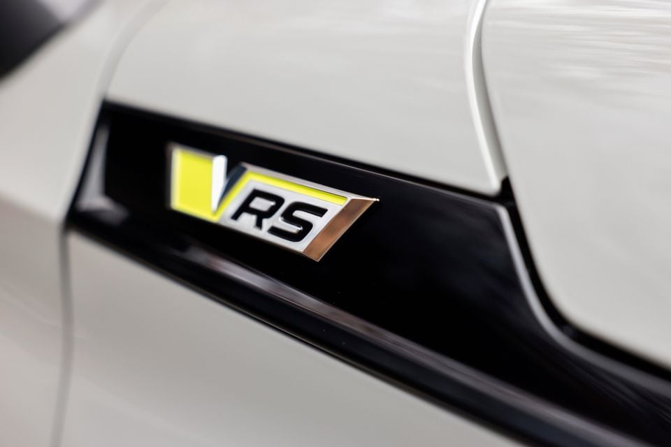 Close-up of the vRS badge on a white Skoda Enyaq RS