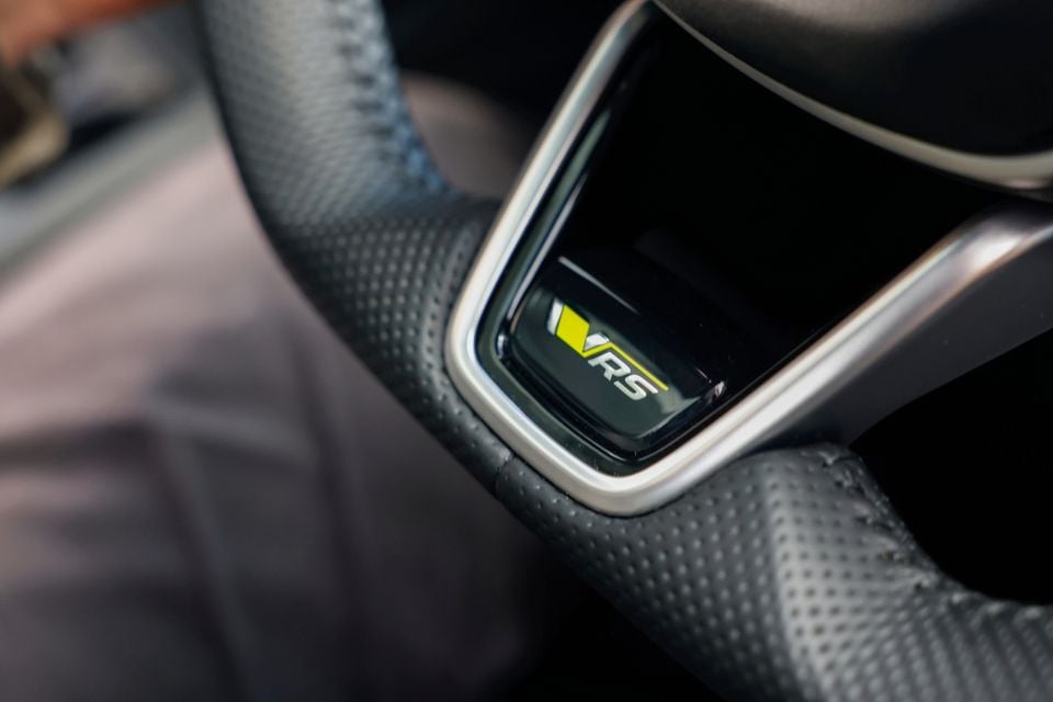 Close-up of the RS badge on the steering wheel of a Skoda Enyaq RS
