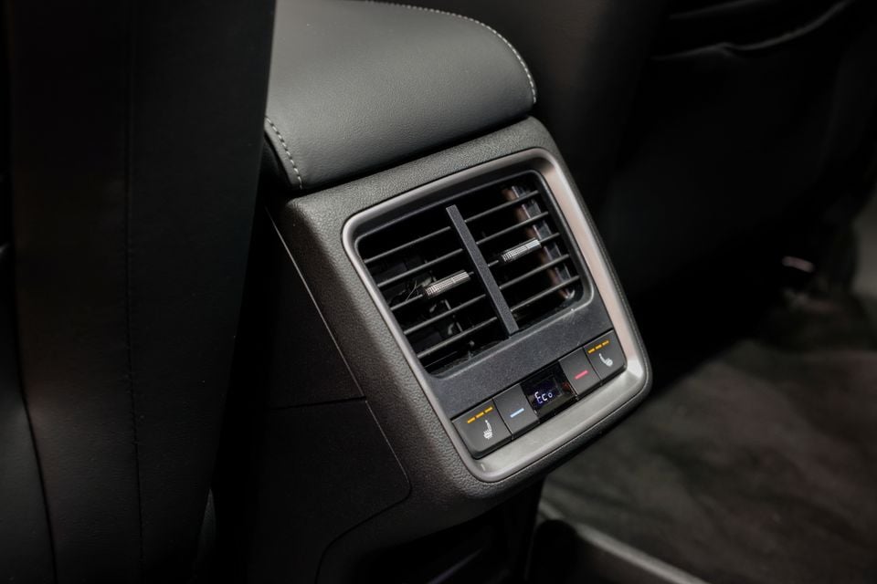 Rear air vents and climate control buttons on the centre console of a 2026 Skoda Enyaq