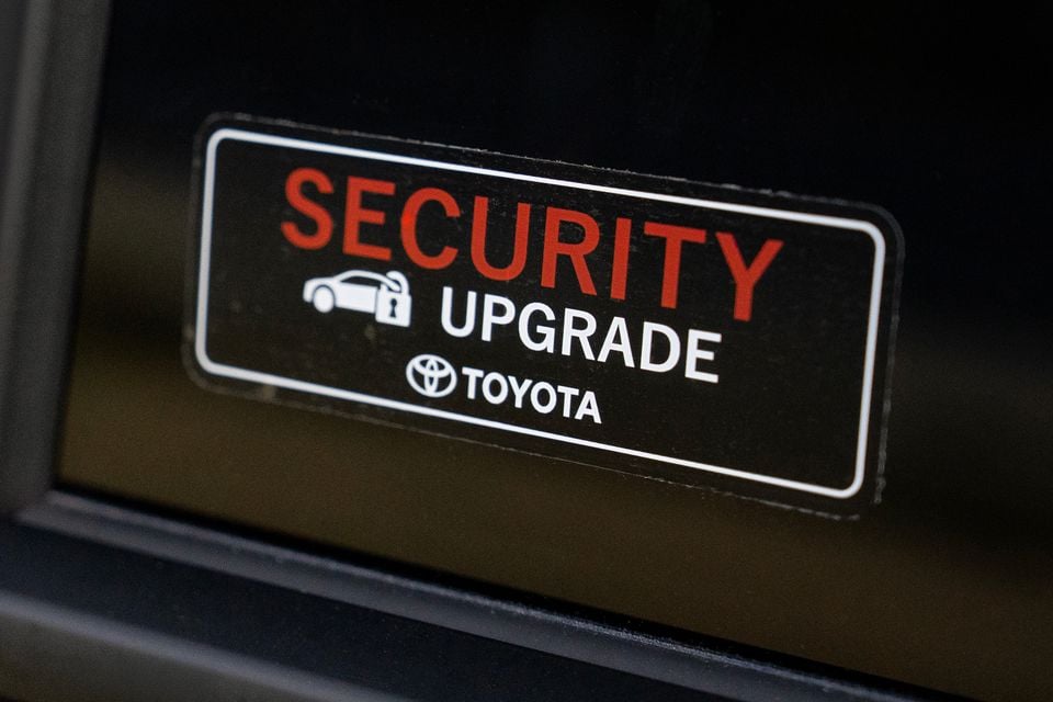 A Toyota Security Upgrade sticker affixed to a car window