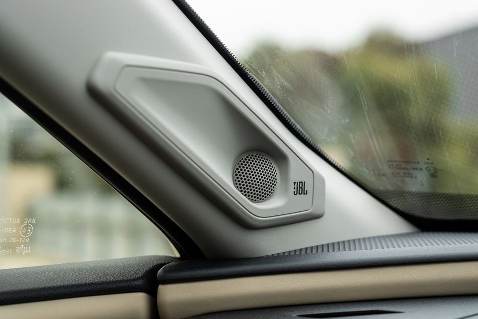 A JBL tweeter speaker mounted in the A-pillar trim of a 2026 Toyota RAV4 Cruiser