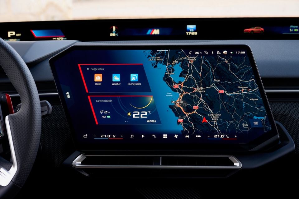 Dashboard of the 2027 BMW M350 3 Series showing a large central touchscreen with navigation map, weather display and climate controls