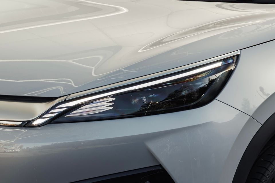 Close-up of the headlight on a silver 2027 BYD Atto 3 Evo Premium
